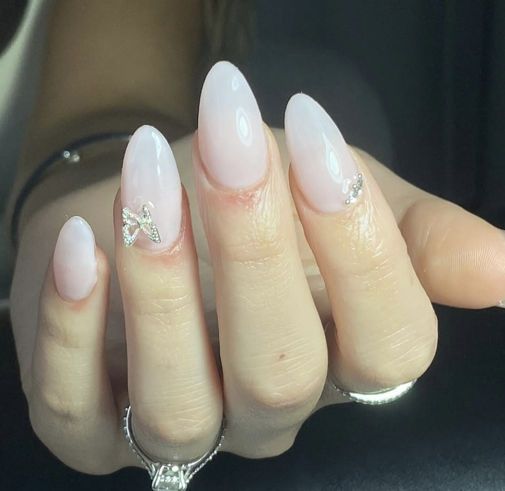 Milky pink almond set with a crystal bow accent